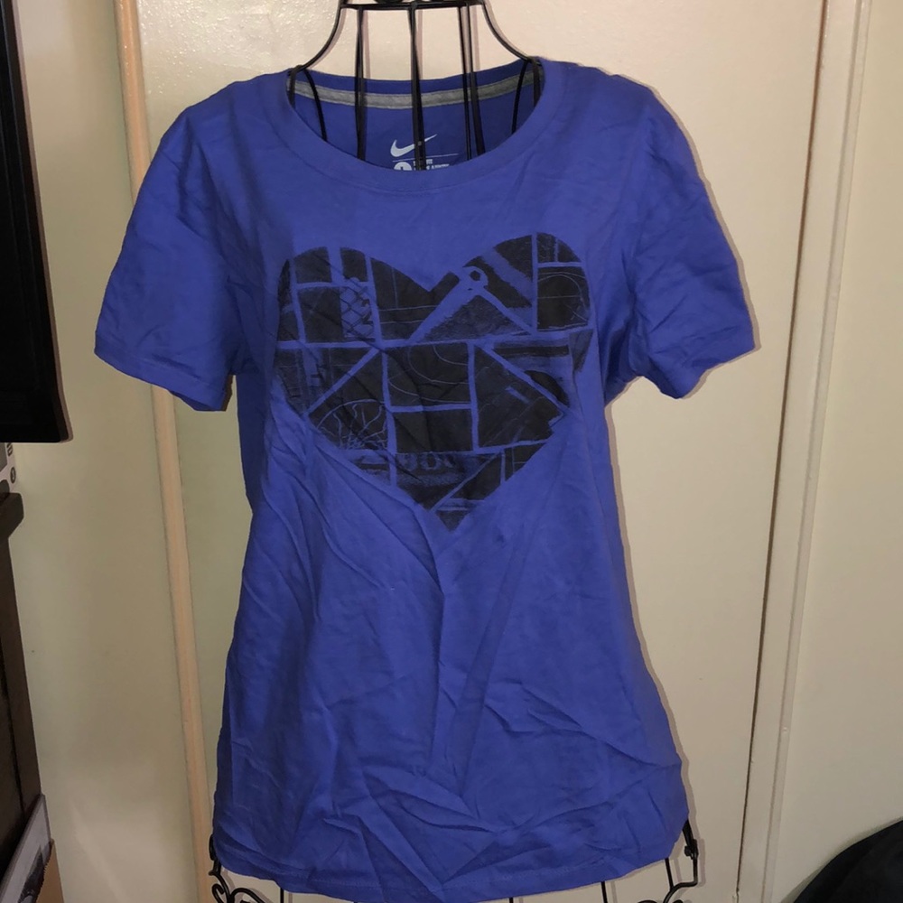 Purple Nike shirt.